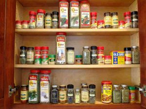 Use a spice rack organizer to maximize space
