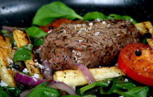 Sprinkle herb salt onto beef steak before serving to enhance the flavour