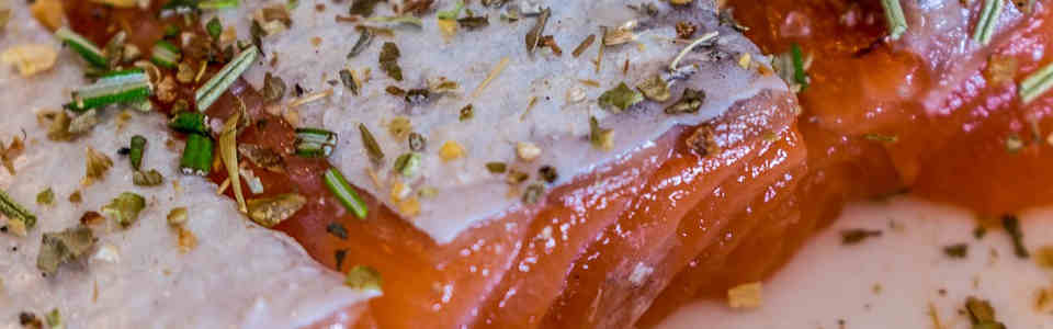 Season fish with herbs and spices to enhance its flavour